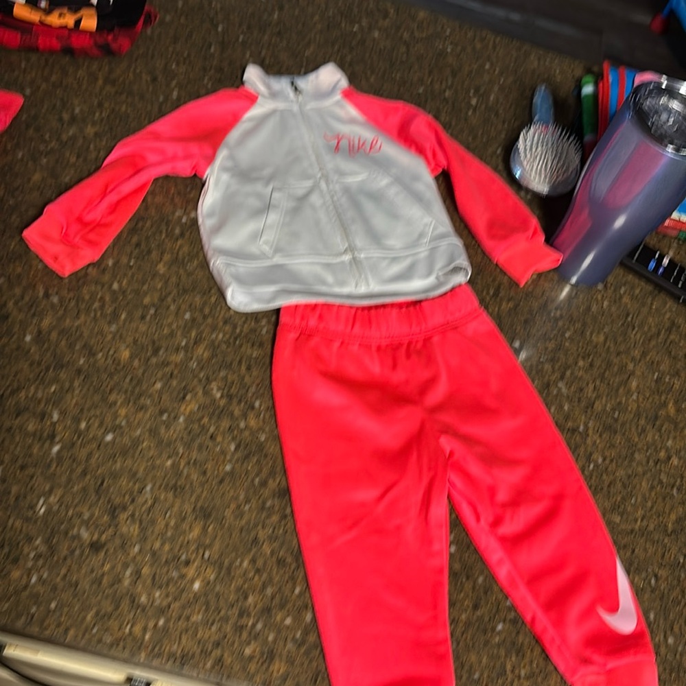 Used Nike track suit for 12m. Neon pink and white
